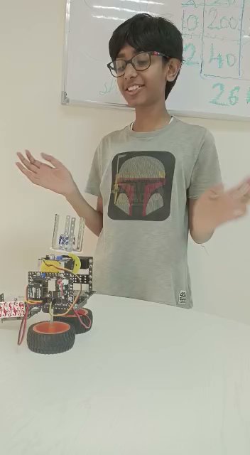 Aarav presenting a robotics build from his workshop album